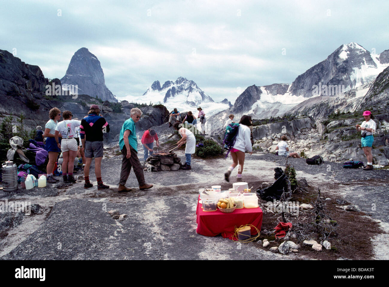 Hikers cooking dinner in the Alpine Region of the Purcell Mountains in Bugaboo Provincial Park British Columbia Canada Stock Photo