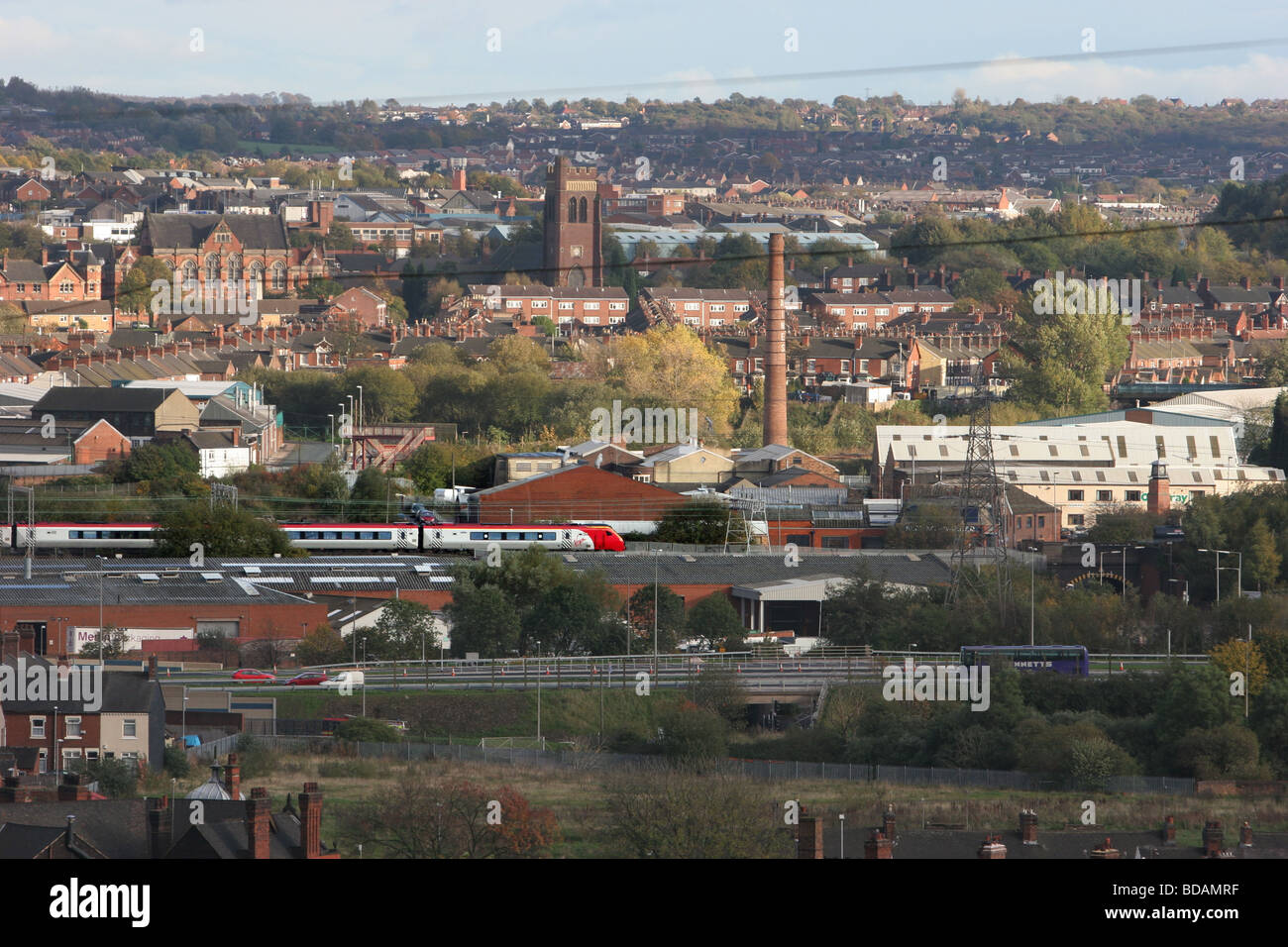 A Virgin train travels through the south of Stoke on Trent in the Potteries Stock Photo