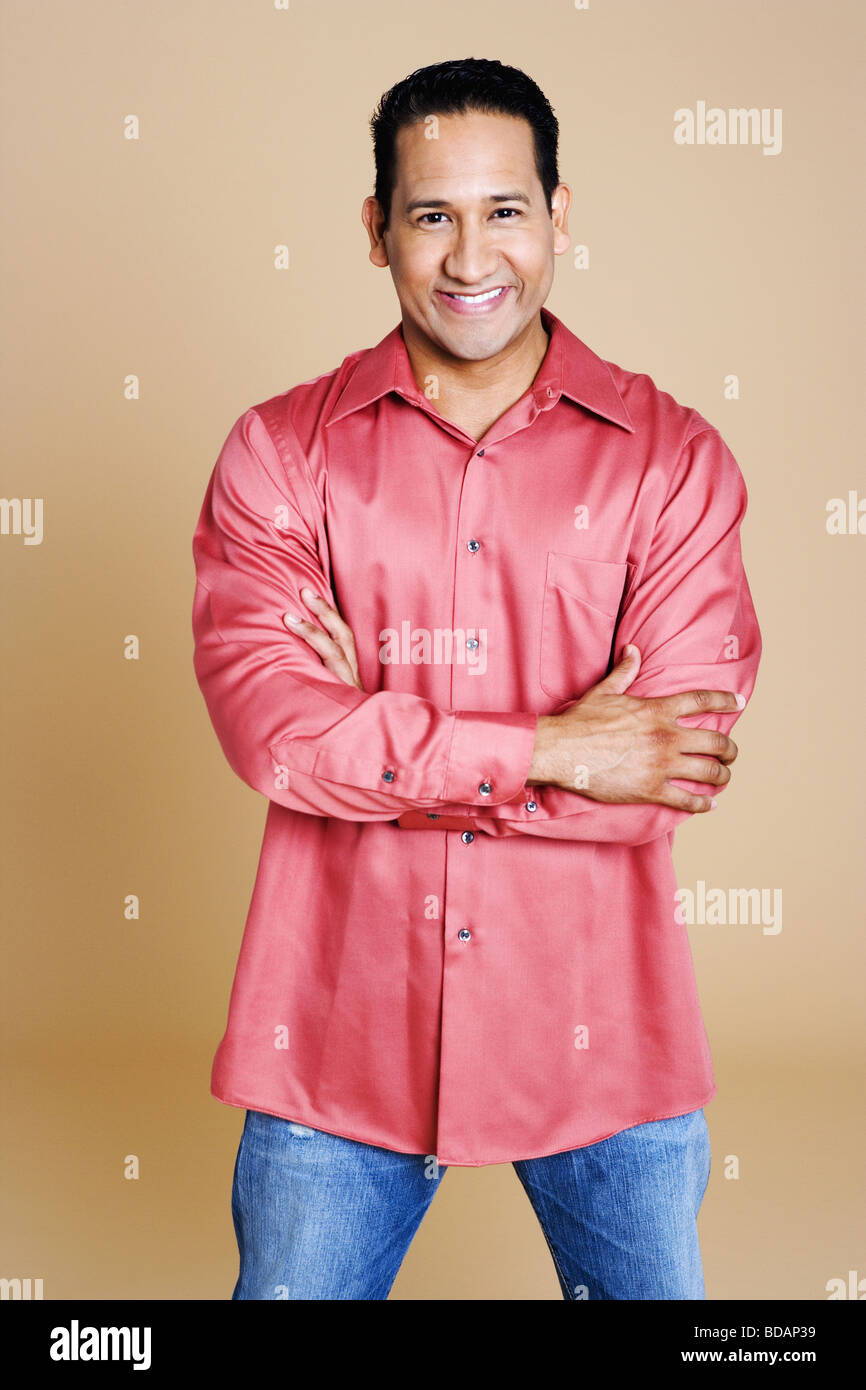 Portrait of a mid adult man standing and smiling Stock Photo - Alamy