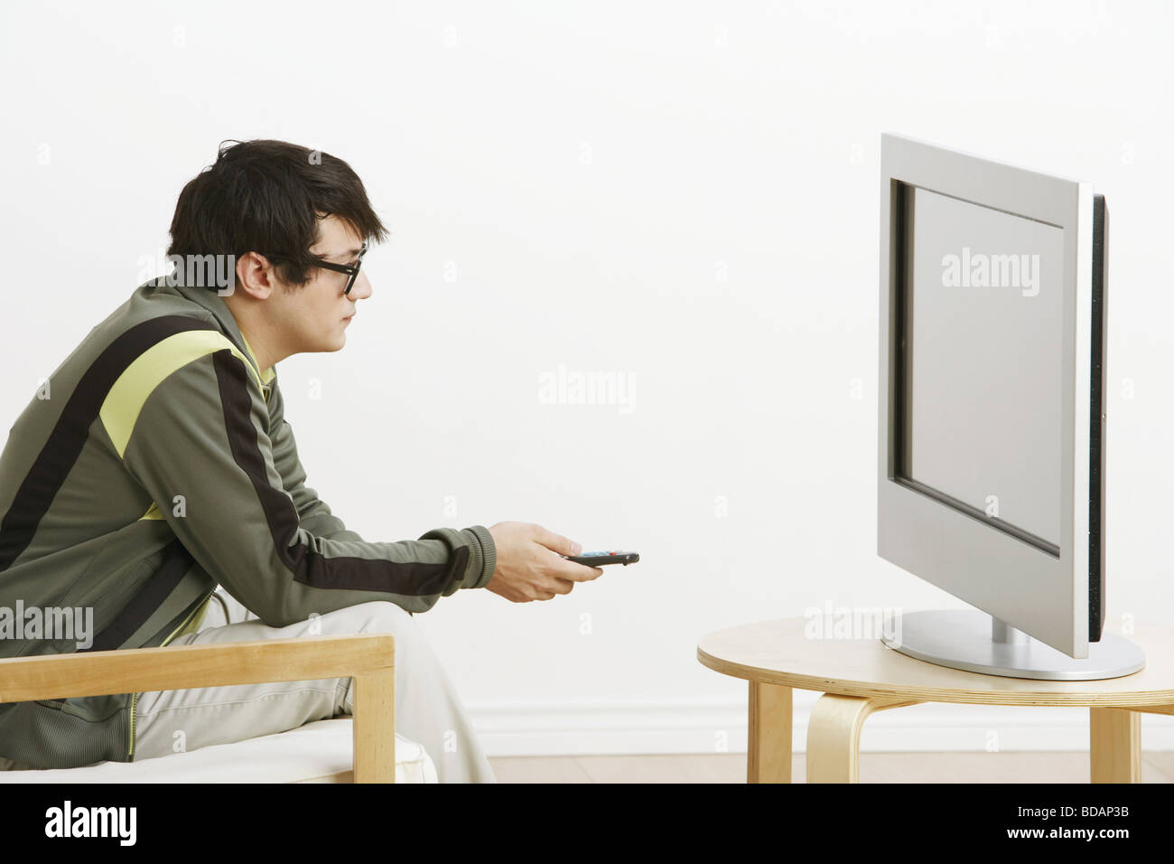 Man Armchair Watching Tv High Resolution Stock Photography and Images
