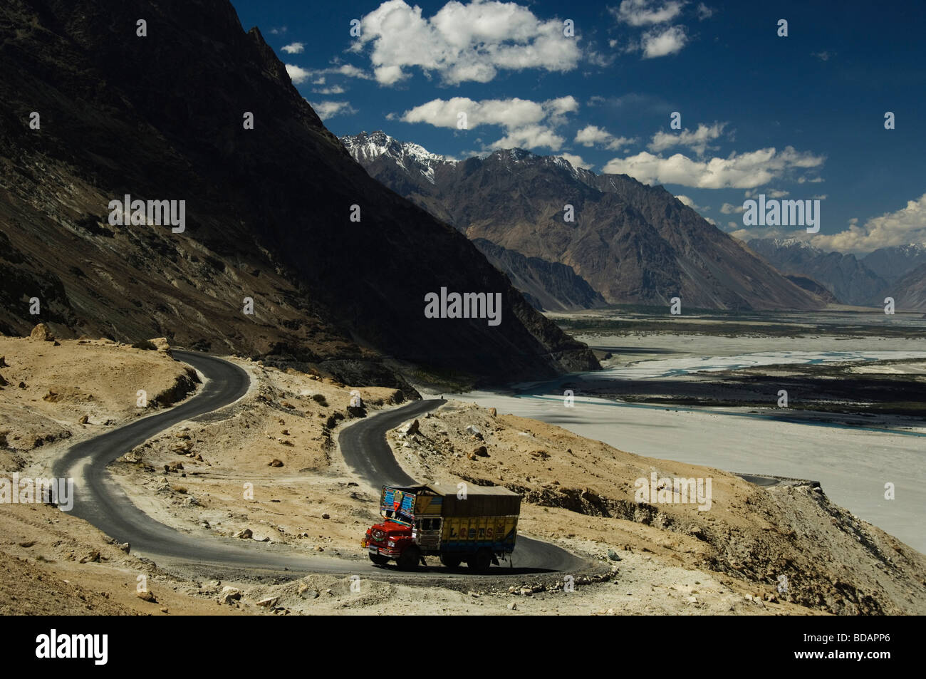 Road passing through mountain ranges, Shyok River, Nubra Valley, Ladakh, Jammu and Kashmir, India Stock Photo