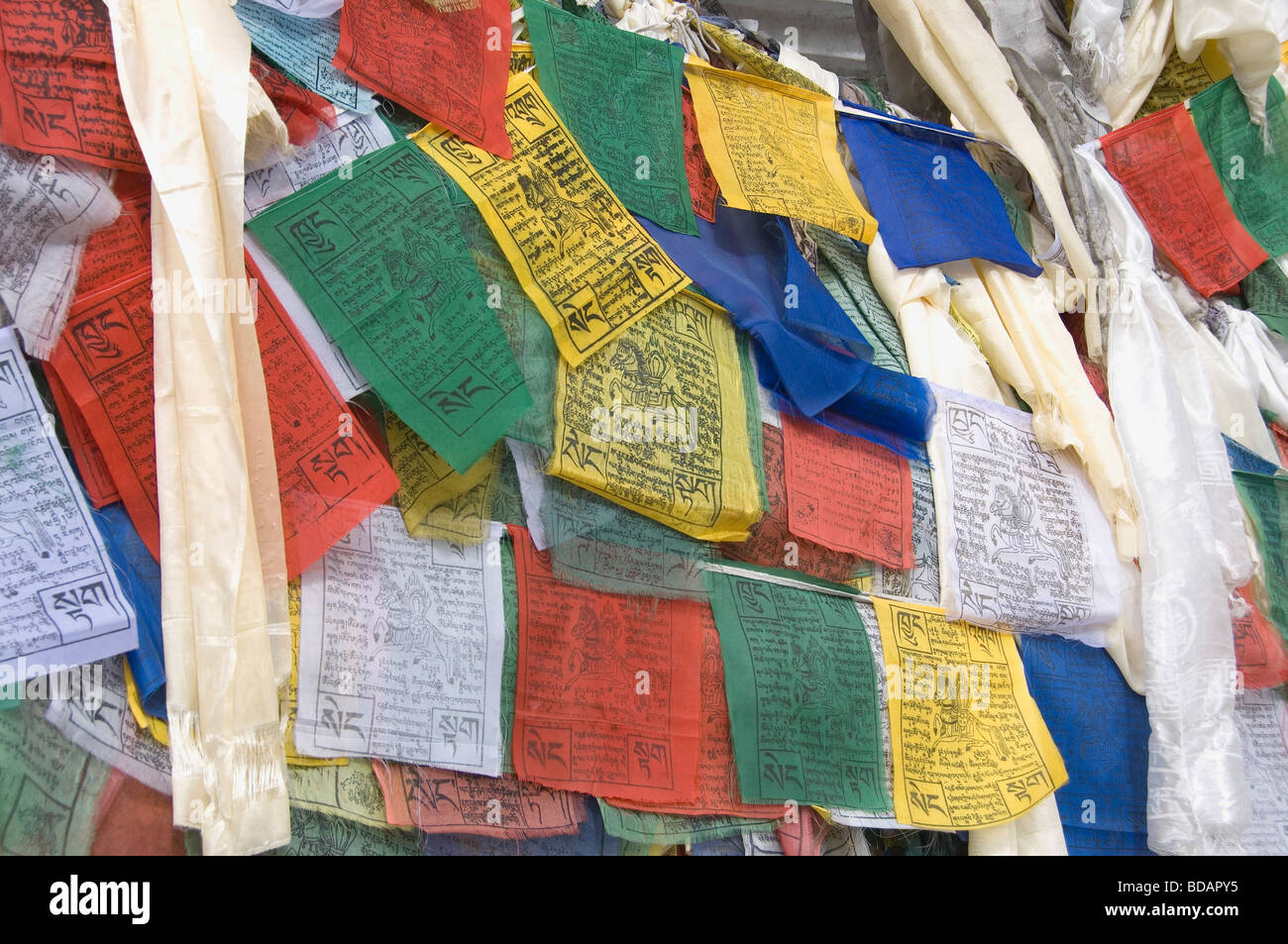 Multi-colored praying flags in a row, Ladakh, Jammu and Kashmir, India Stock Photo