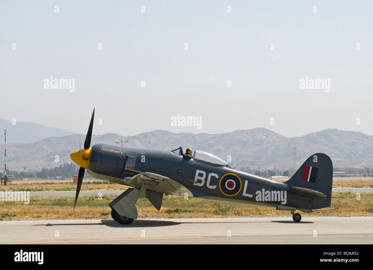 A Hawker Sea Fury taxis on the runway after flying at an air show. Stock Photo