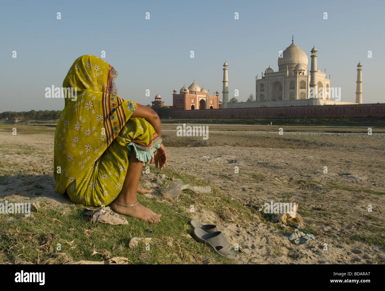 Woman resting while looking at The Taj Mahal, Agra, Uttar Pradesh, India Stock Photo