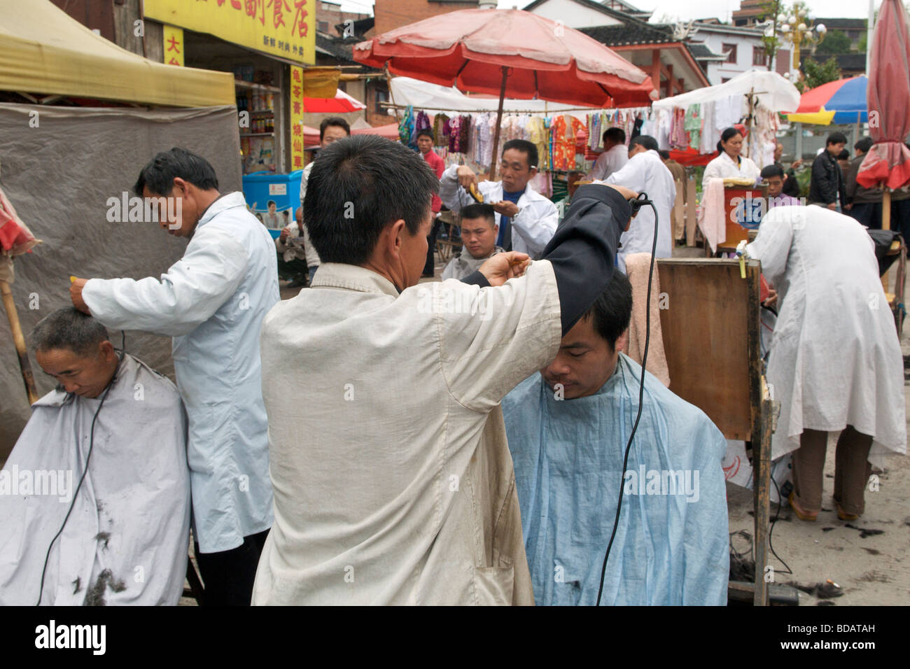 Barbers salon in street market Kaili Guizhou Province China Stock Photo