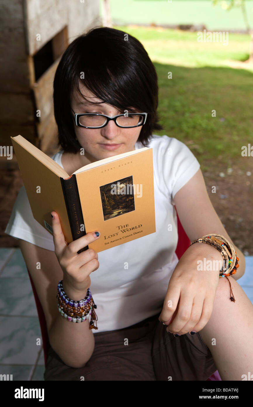 Indonesia Sulawesi Buton Labundo Bundo Operation Wallacea volunteer reading book in free time Stock Photo
