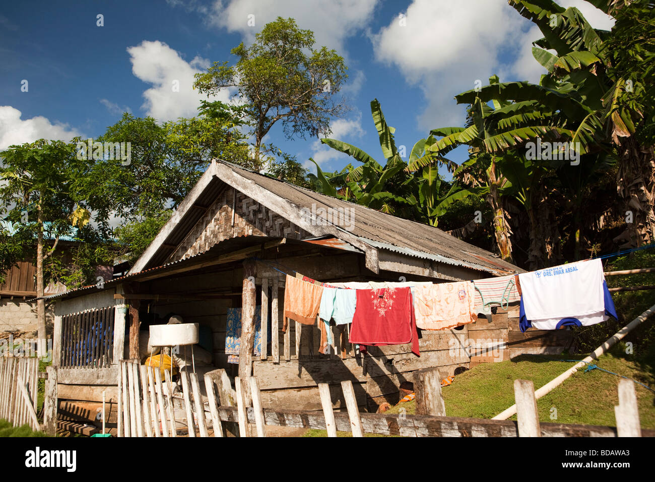 Indonesia Sulawesi Buton Labundo Bundo washing hanging outside wooden house Stock Photo