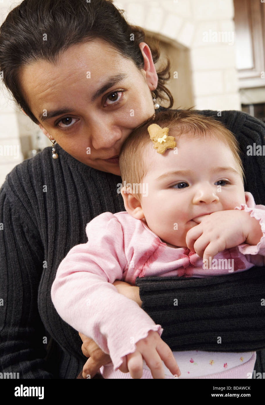 Mother holding baby close hi-res stock photography and images - Alamy