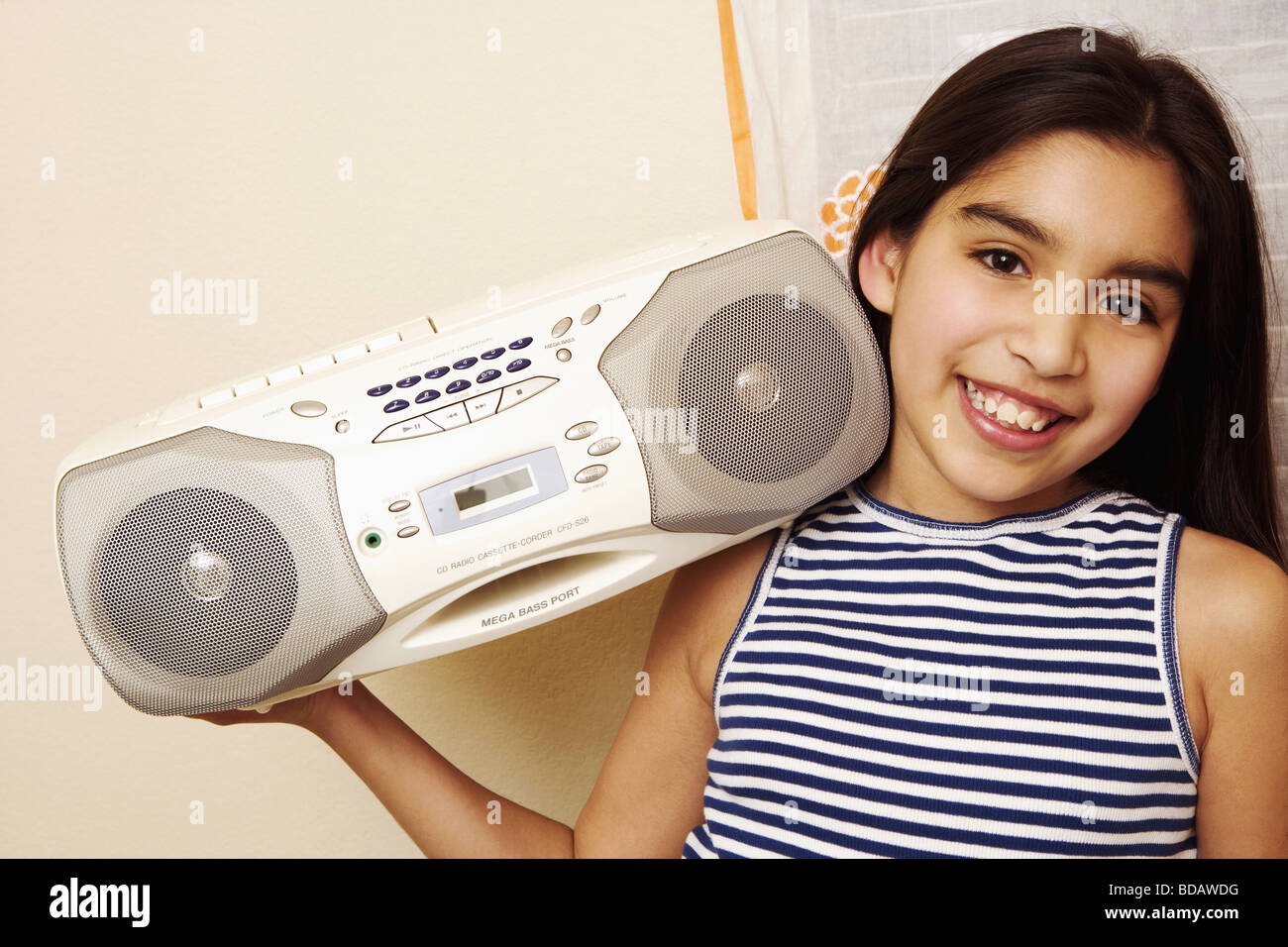 Portrait of a girl holding a tape recorder and smiling Stock Photo Alamy