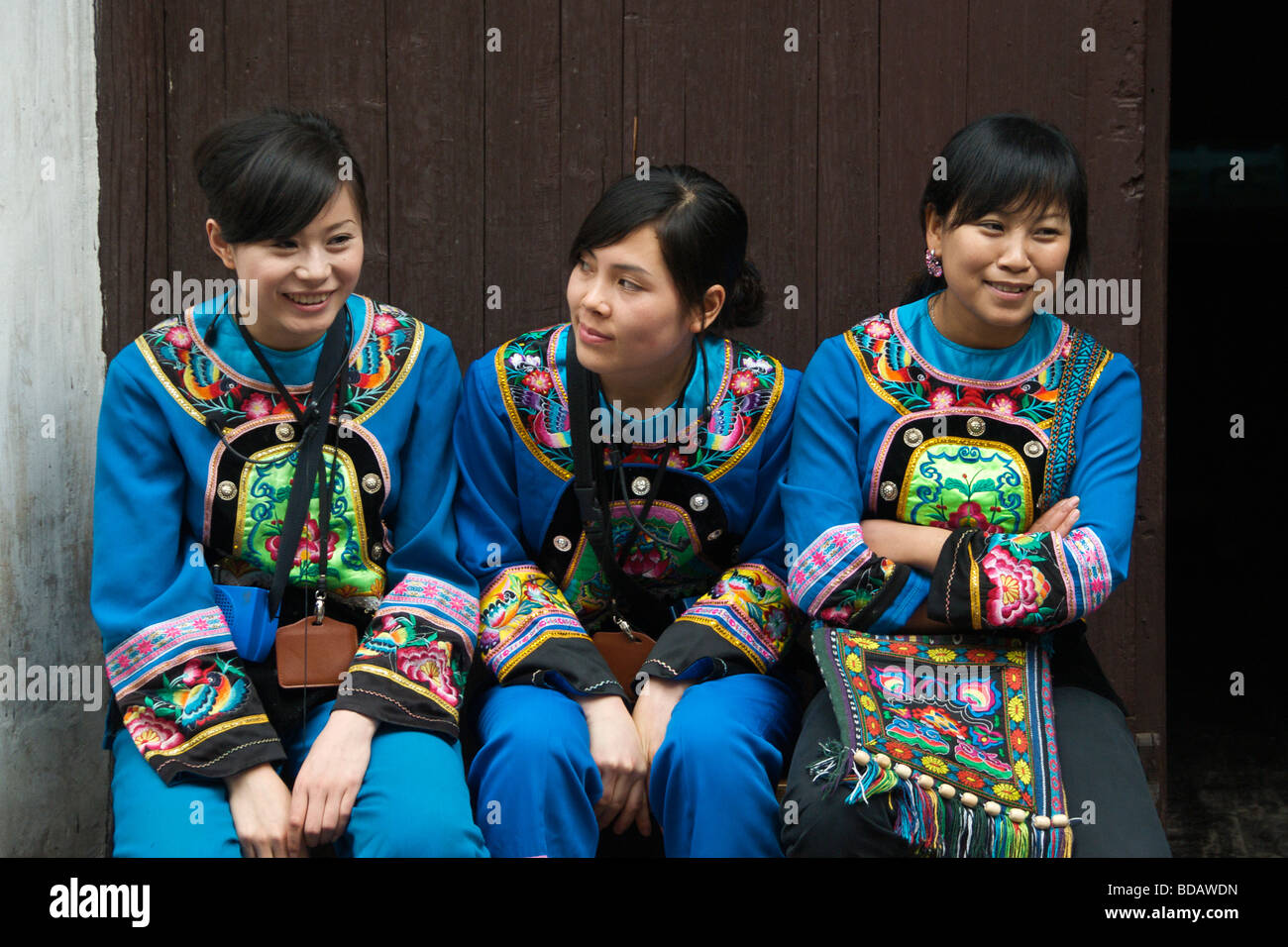 Three pretty female guides Ancient Town of Fenghuang Hunan China Stock Photo