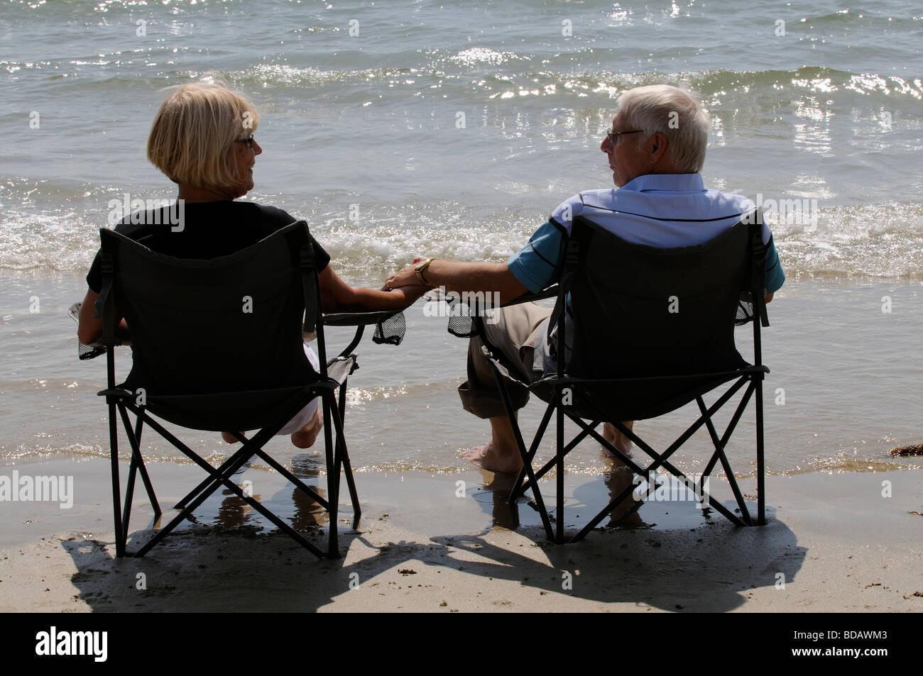 Man sitting hand folding hi-res stock photography and images - Alamy