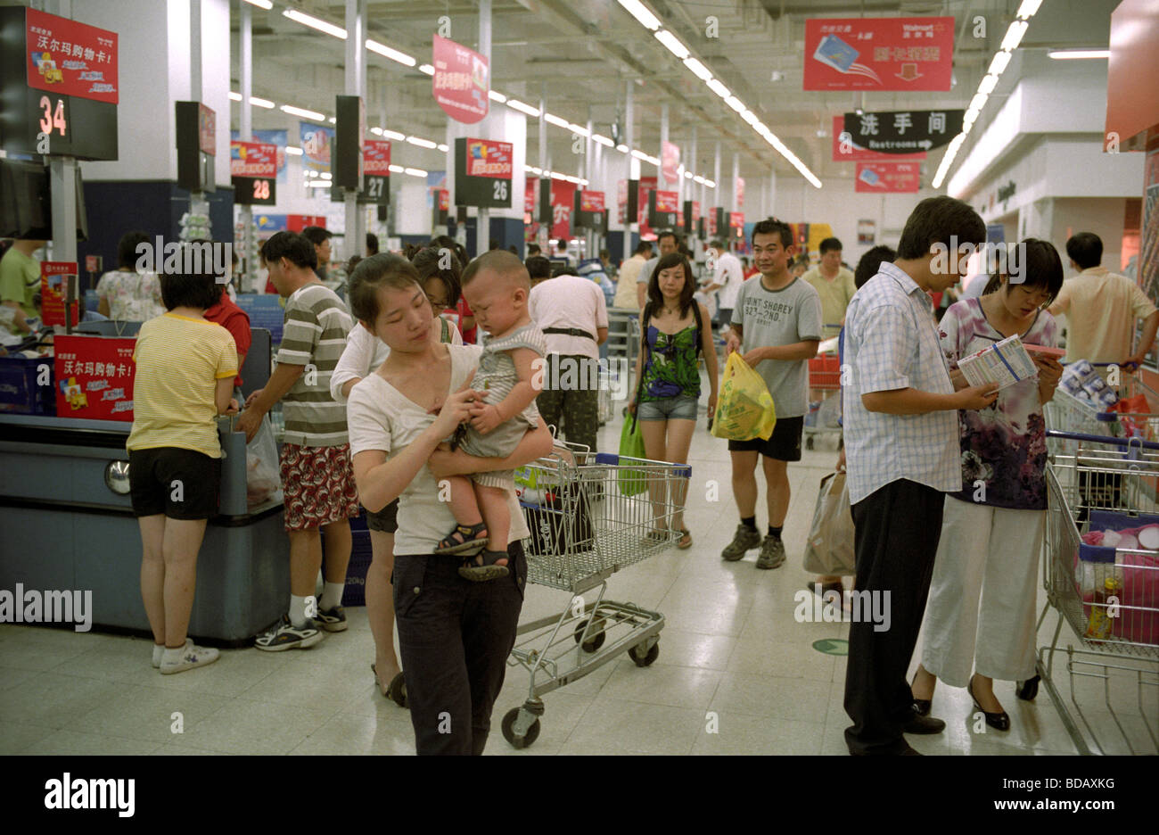 Chinese customers shopping at a WalMart supermarket in Beijing, China