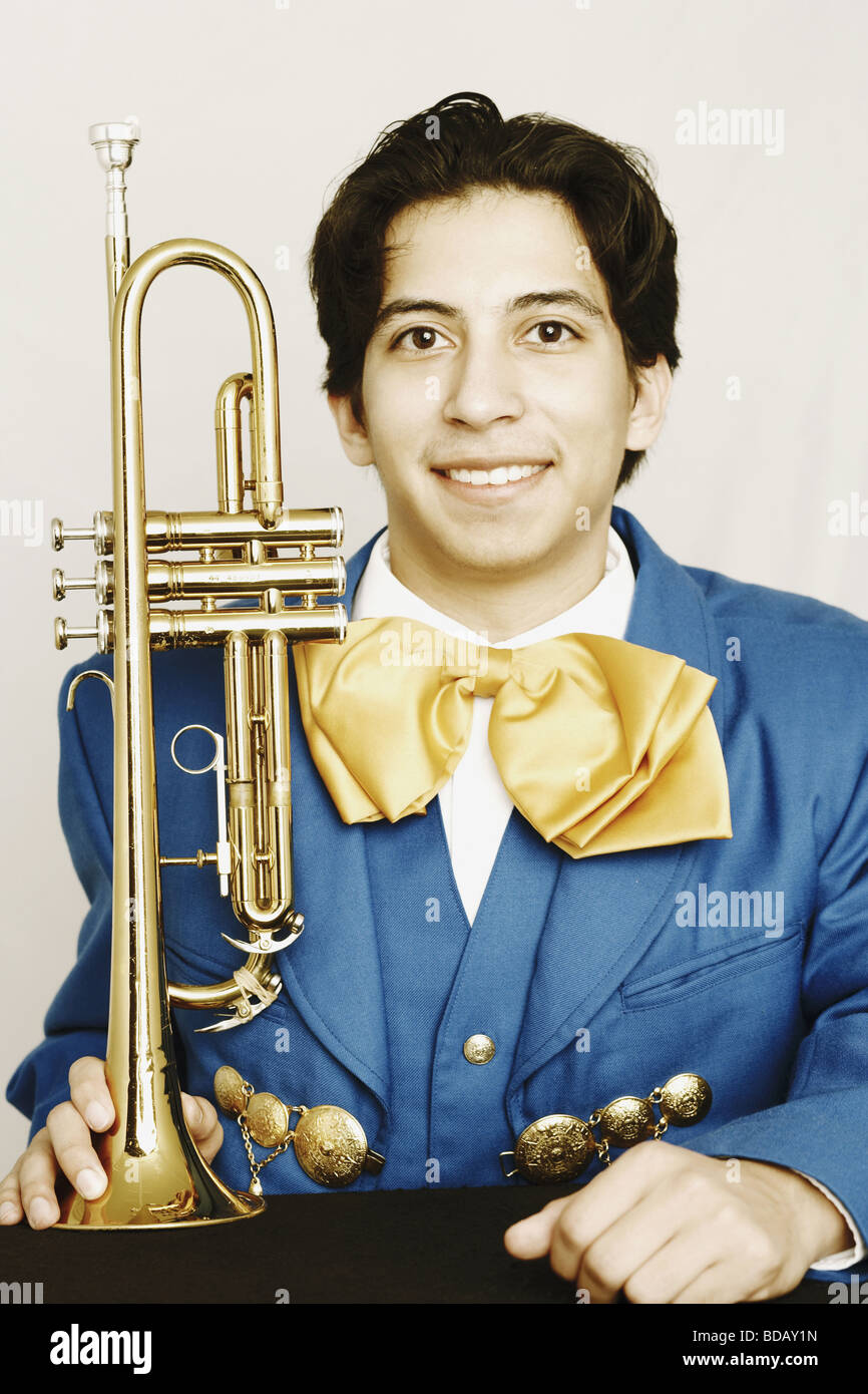 Young man holding trumpet hires stock photography and images Alamy