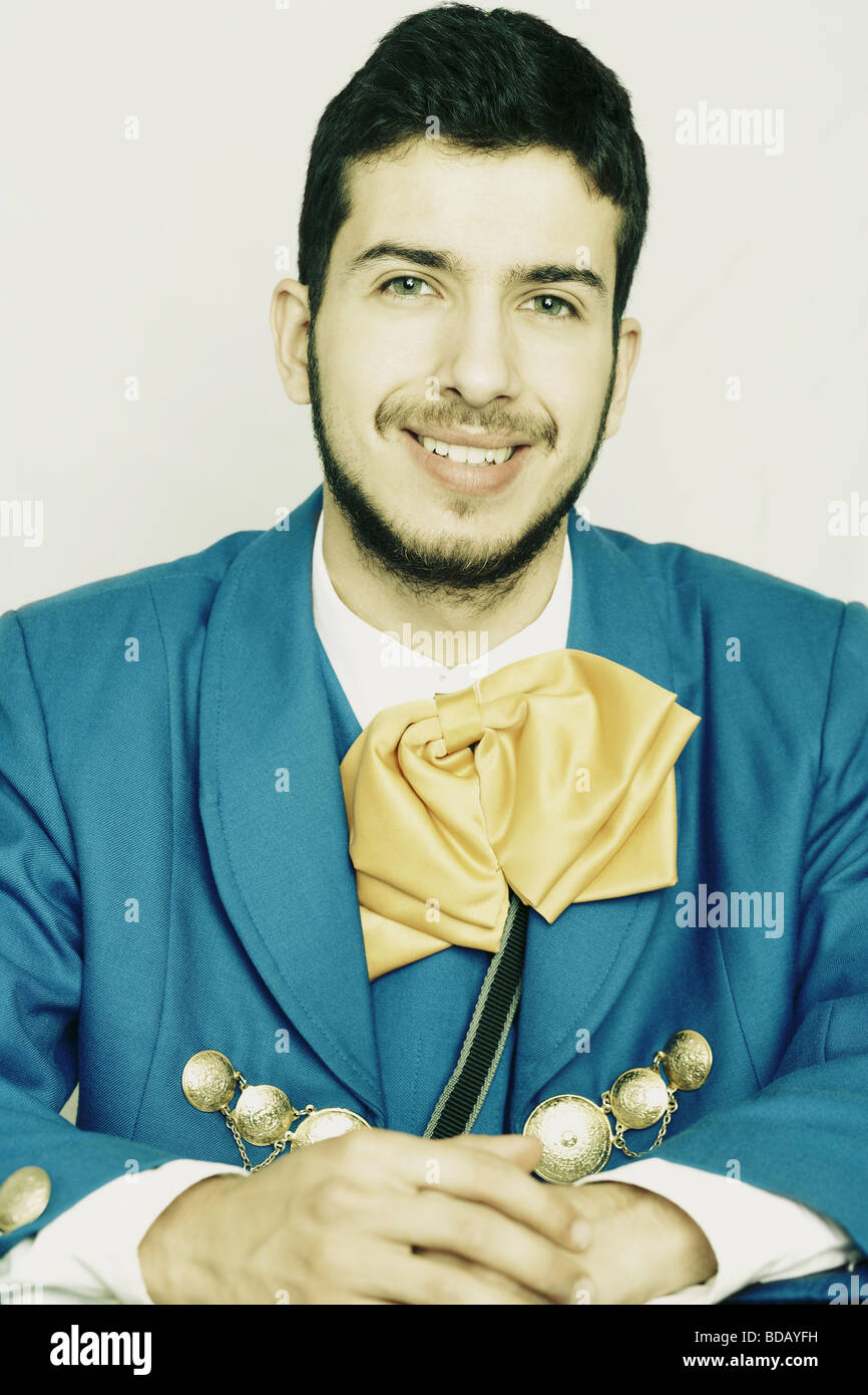 Portrait of a young man smiling in traditional clothing Stock Photo - Alamy