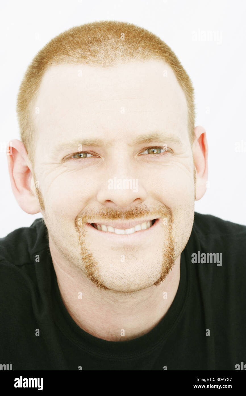 Portrait of a young man smiling Stock Photo - Alamy
