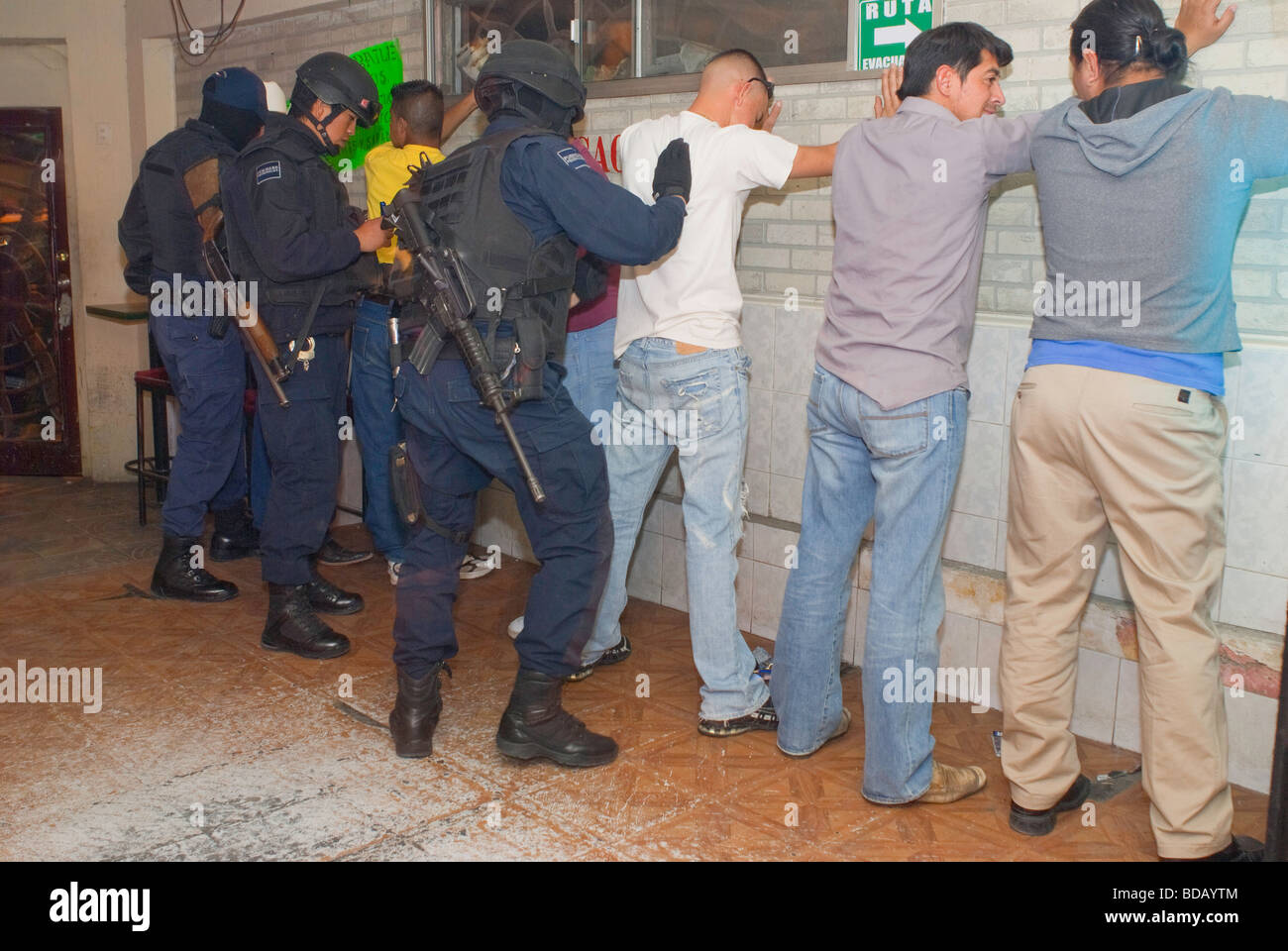 Army troops and federal police patrol the streets of Juarez  entering cantinas and prostitution hotels for drugs and firearms. Stock Photo