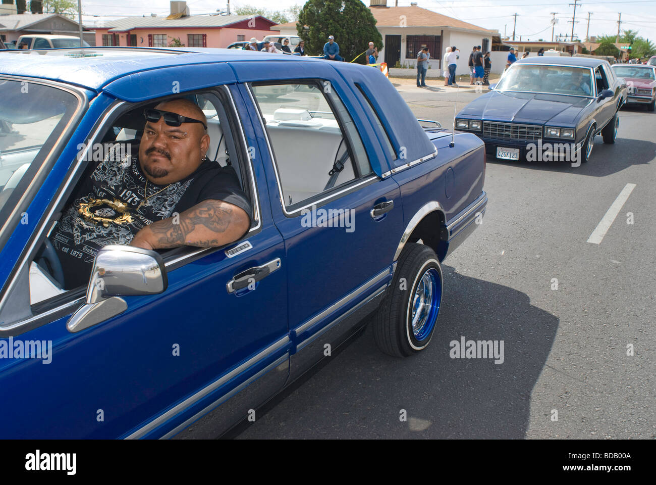 Low riders in their cars participate in an Easter parade in El Paso, Texas. Stock Photo