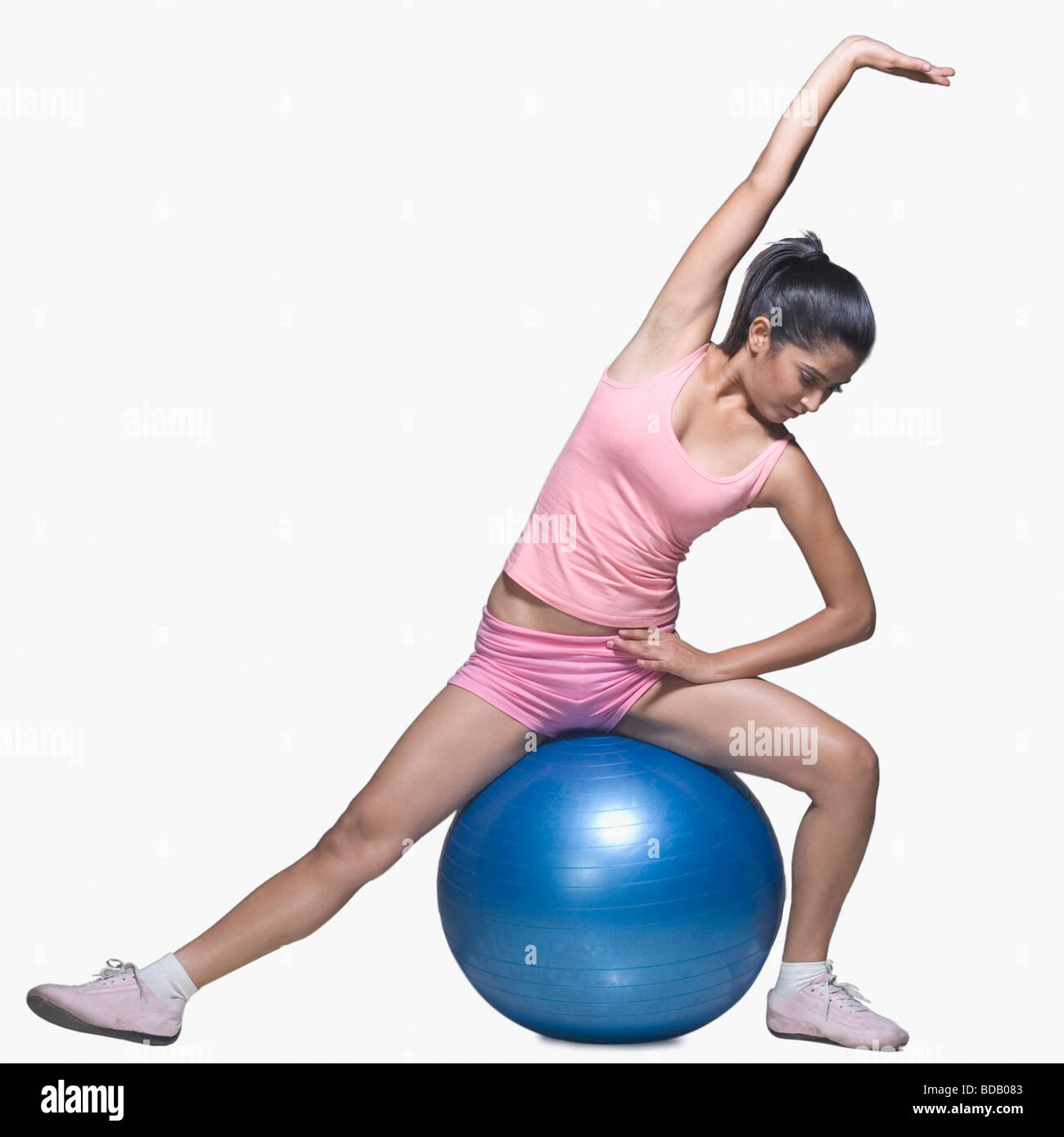 Young woman exercising on a fitness ball Stock Photo - Alamy
