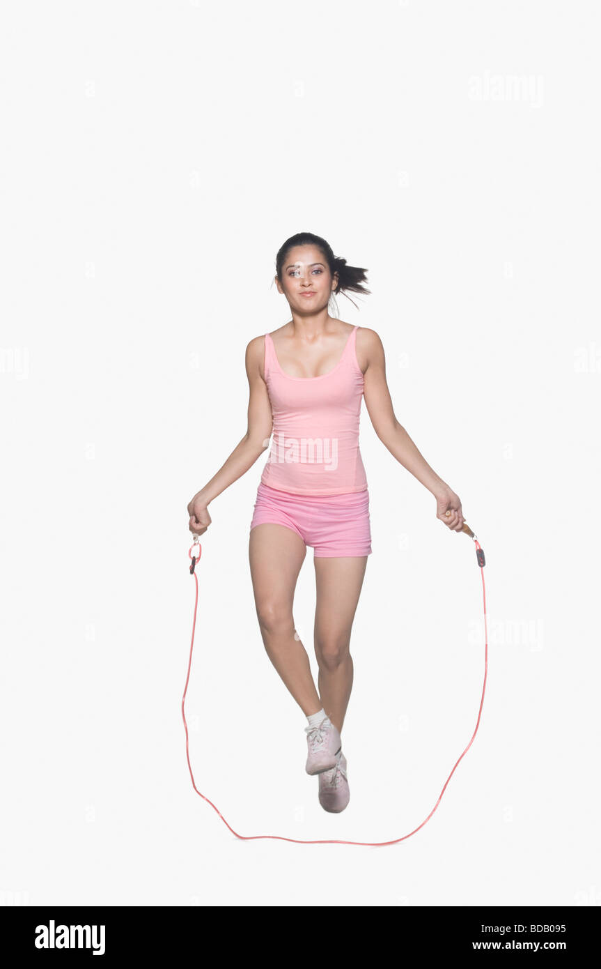 Portrait of a young woman jumping rope Stock Photo Alamy