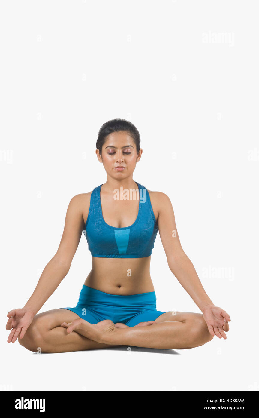 Close-up of a young woman practicing yoga Stock Photo