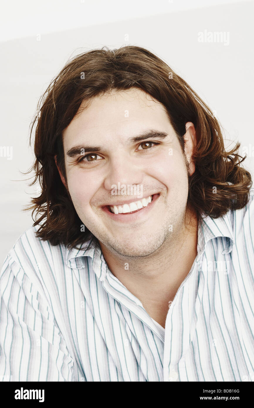 Portrait of a young man smiling Stock Photo - Alamy