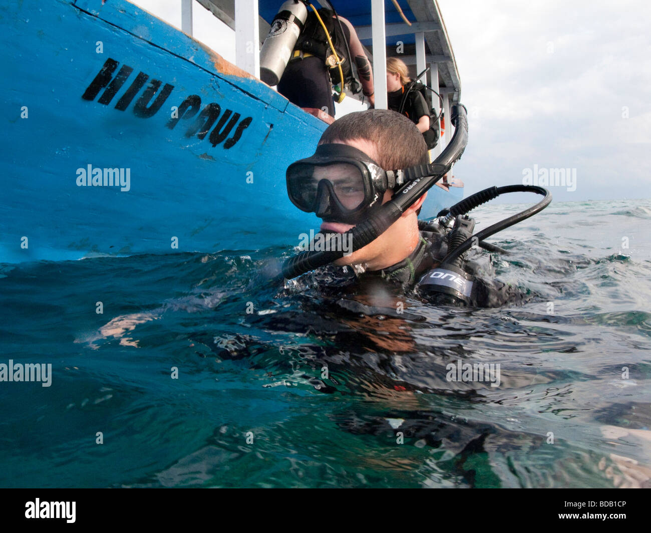 Indonesia Sulawesi Hoga Island Operation Wallacea diver on surface of water at dive boat Stock Photo