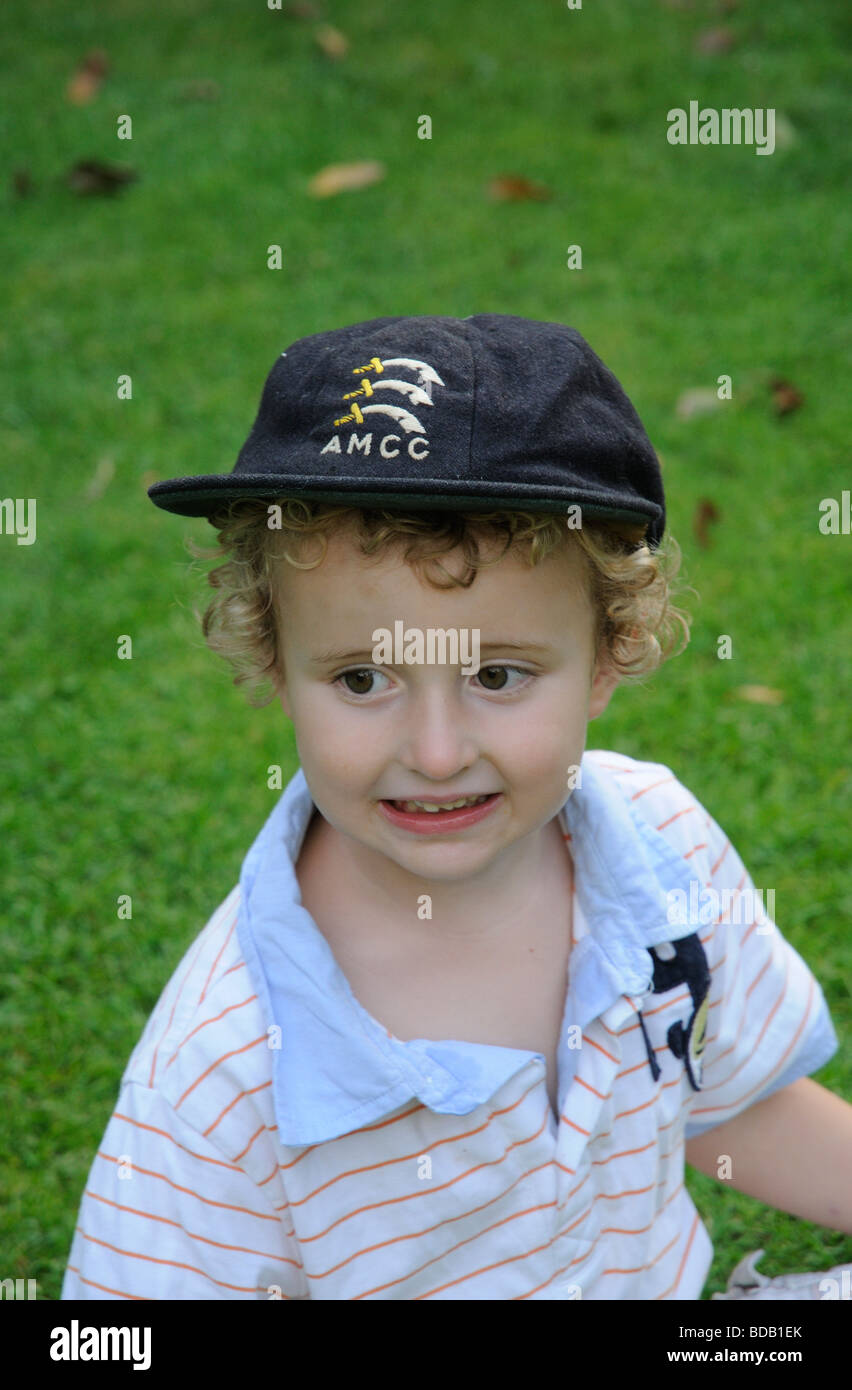 Little boy dressing up and wearing a AMCC cricket cap Stock Photo Alamy