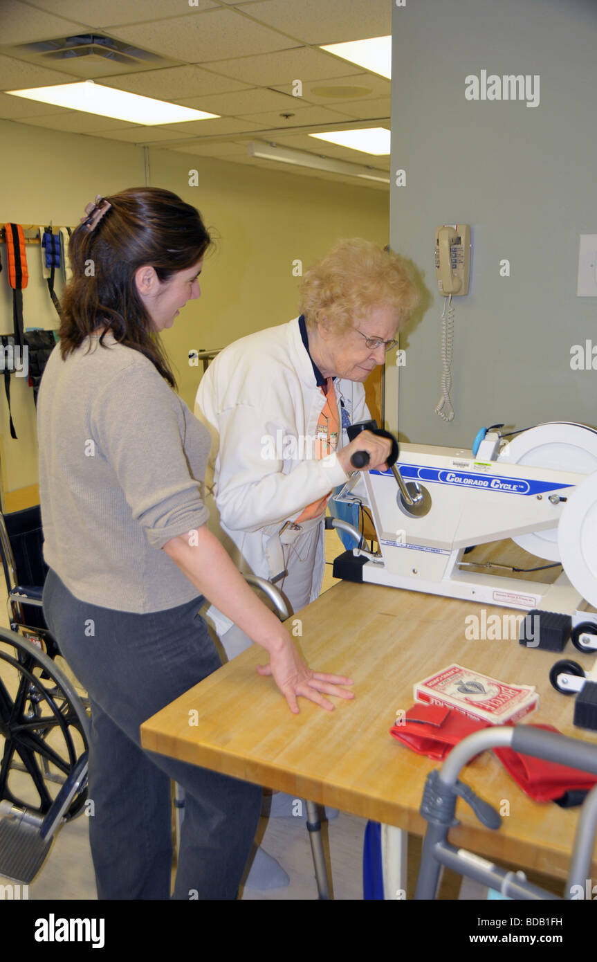 Senior female in medical rehabilation after knee replacement operation Stock Photo