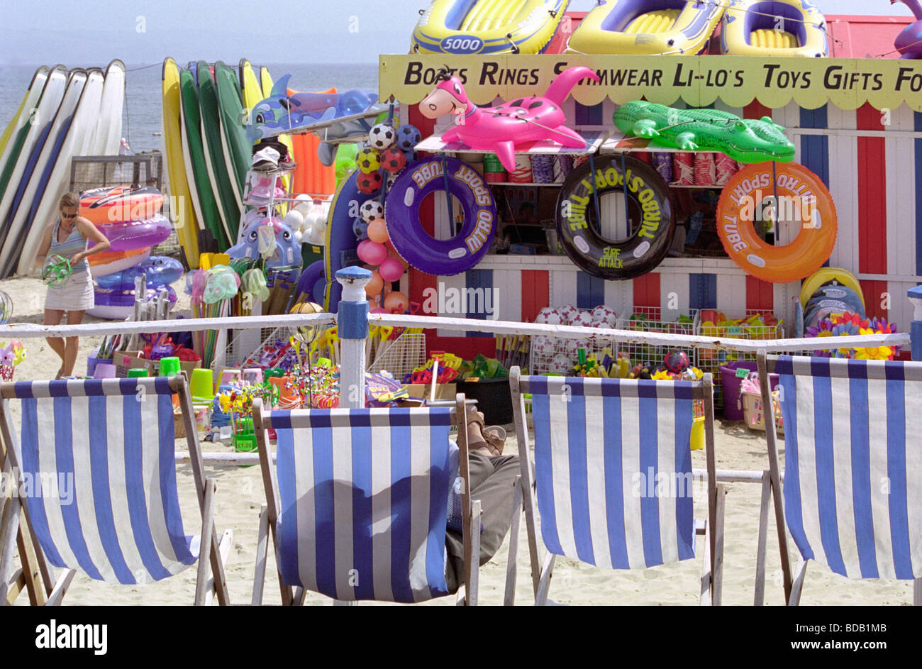British seaside series, beach paraphernalia and a man relaxing in a