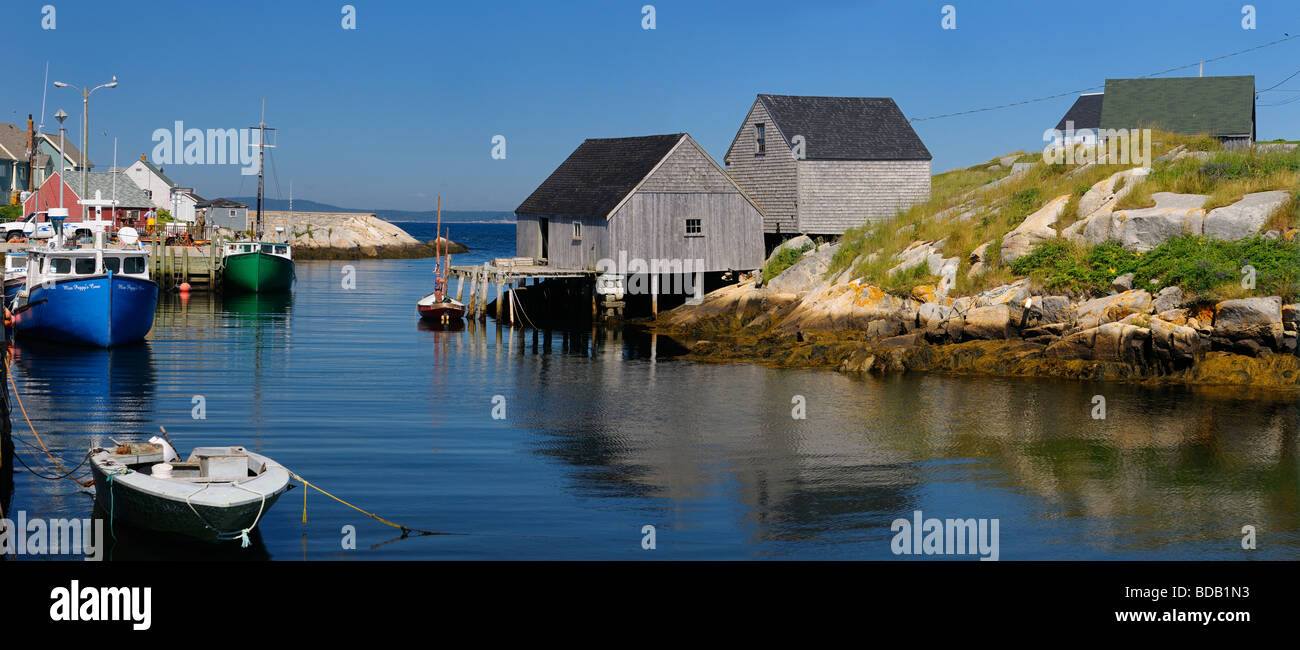Panorama of inlet to Peggys Cove off of St Margarets Bay Nova Scotia with fishing village houses and boats Stock Photo