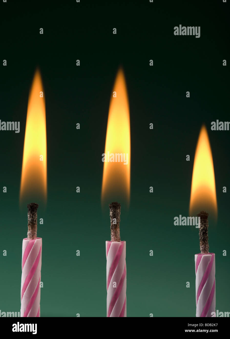 Closeup of burning birthday candles Stock Photo Alamy