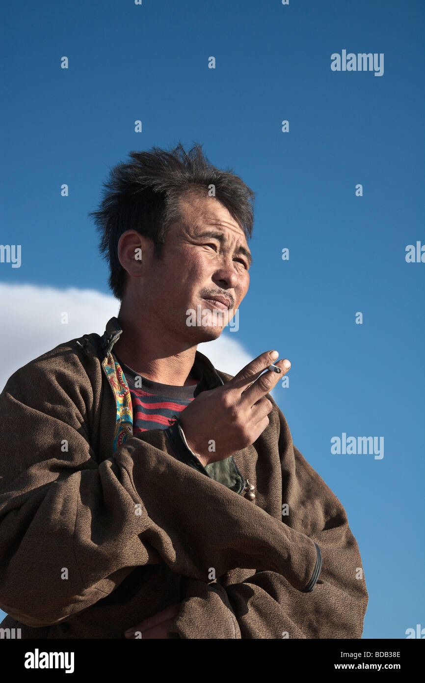 Mongolian herder takes a tobacco break, north central Mongolia Stock Photo