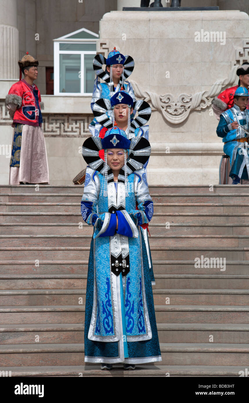 Mongolian dancers in traditional clothing perform on the staircase of the Government House, Ulaan Baatar, Mongolia Stock Photo