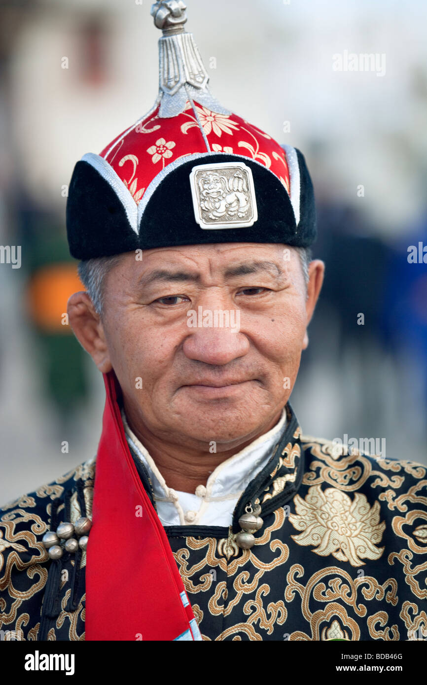 Mongolian man displays traditional clothes and hat, Ulaan Baatar, Mongolia Stock Photo
