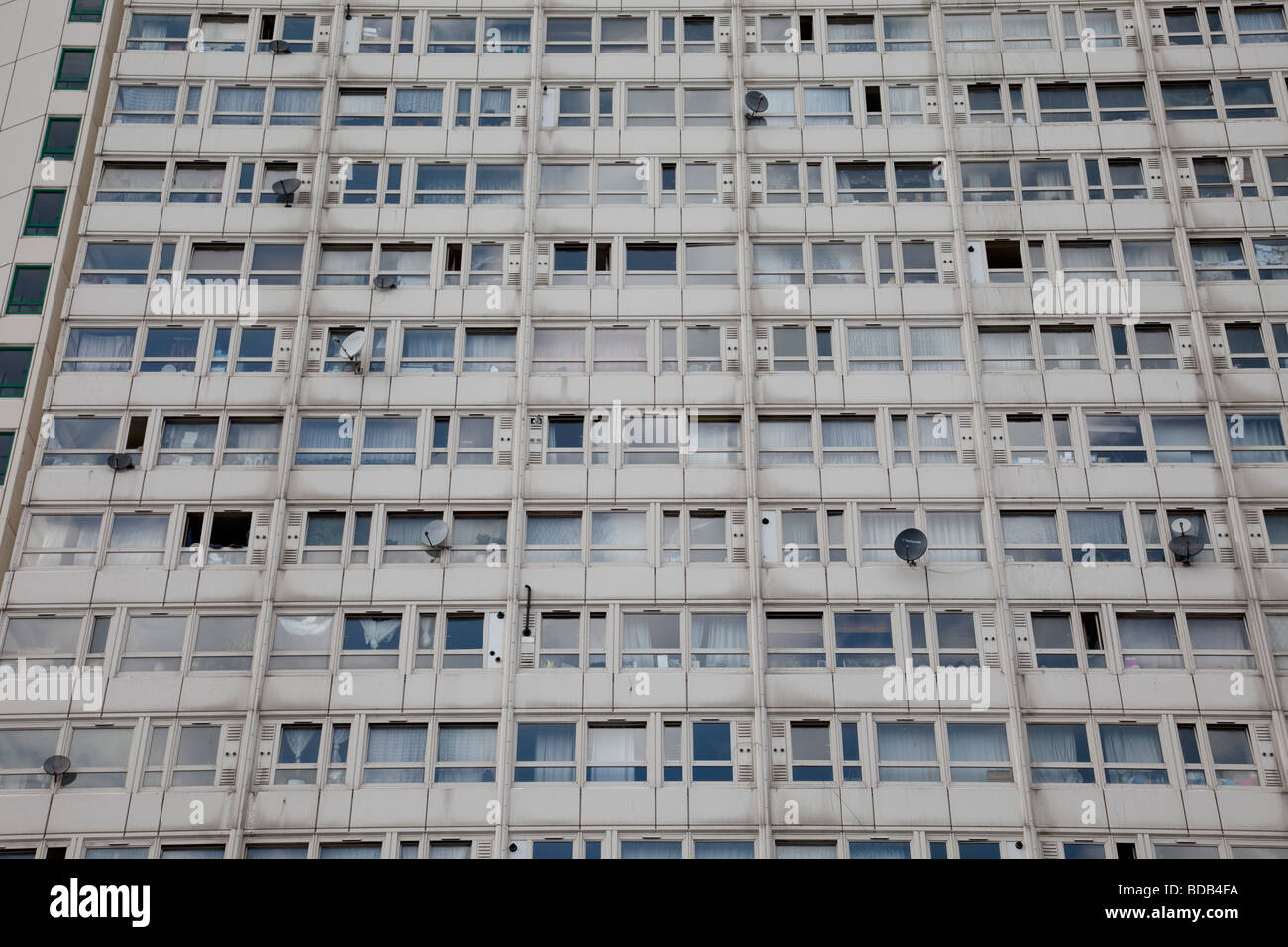 Windows of a council flat housing block in Deptford South East London. This high rise block is in some disrepair Stock Photo