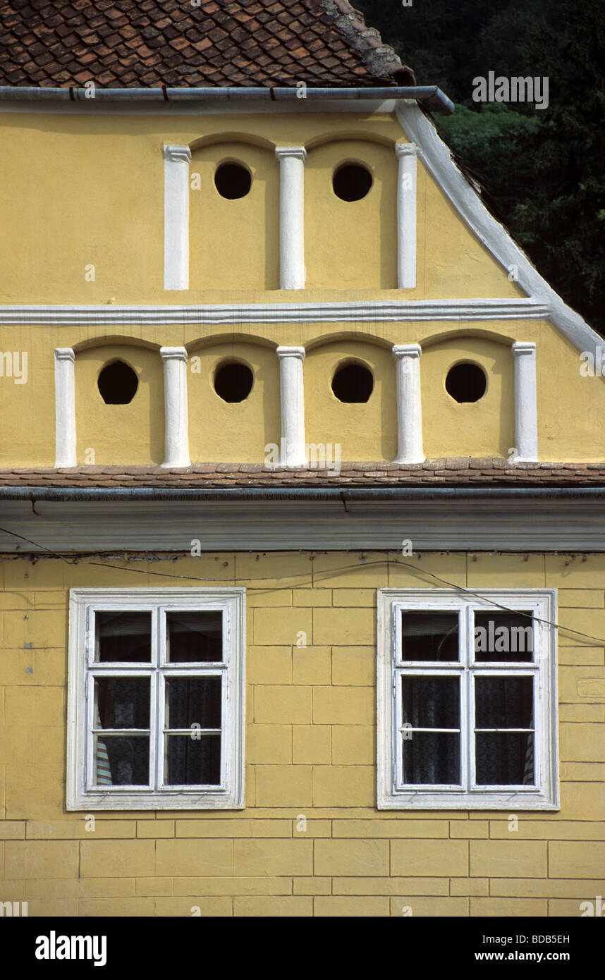Saxon Style House Facade with Pigeonholes of Dovecote or Pigeon House, Brasov, Transylvania, Romania Stock Photo