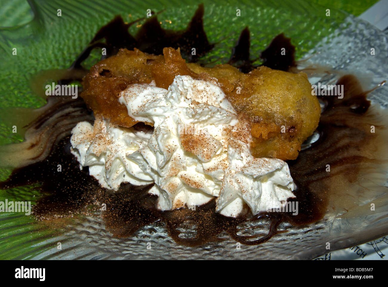 Deep fried battered Mars candy bar whipped cream garnish chocolate