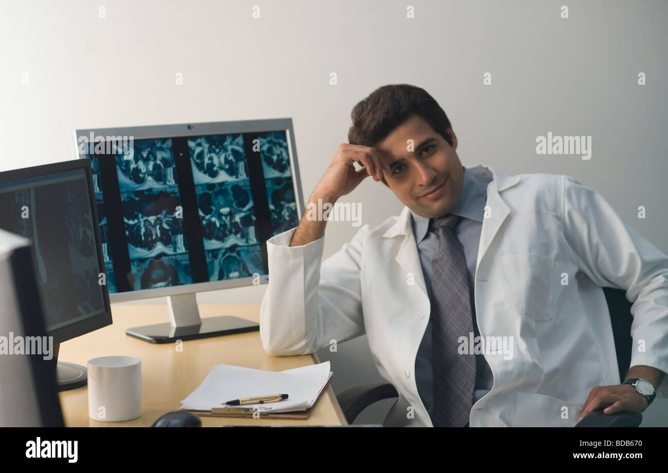 Portrait of a male doctor smiling Stock Photo - Alamy
