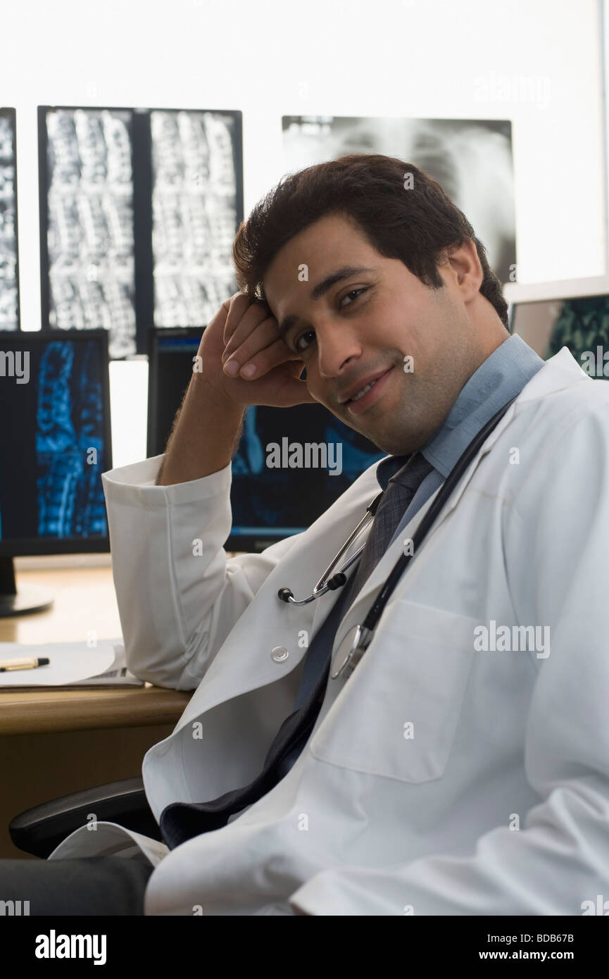 Portrait of a male doctor smiling Stock Photo - Alamy