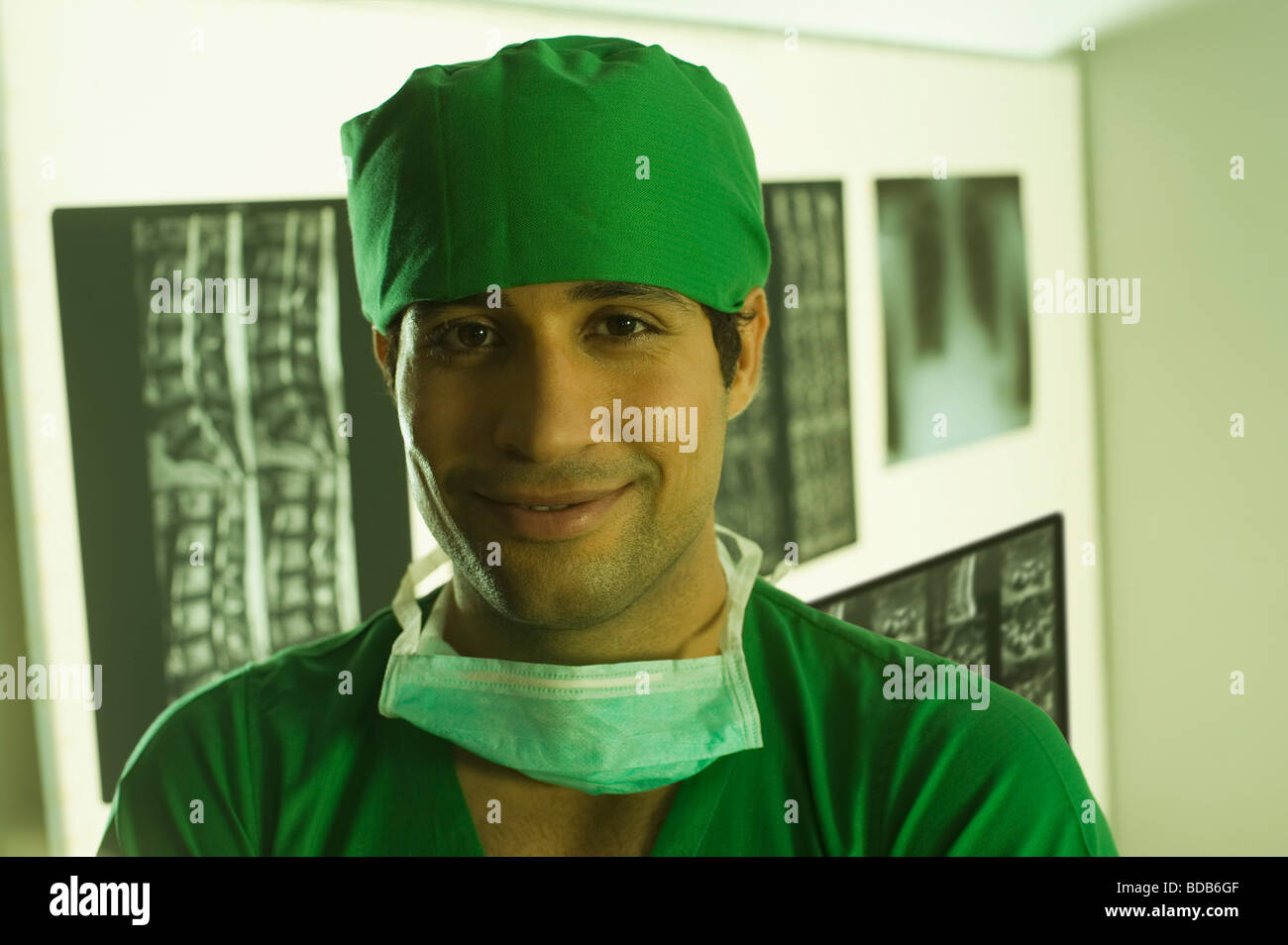 Portrait of a male surgeon smiling Stock Photo - Alamy
