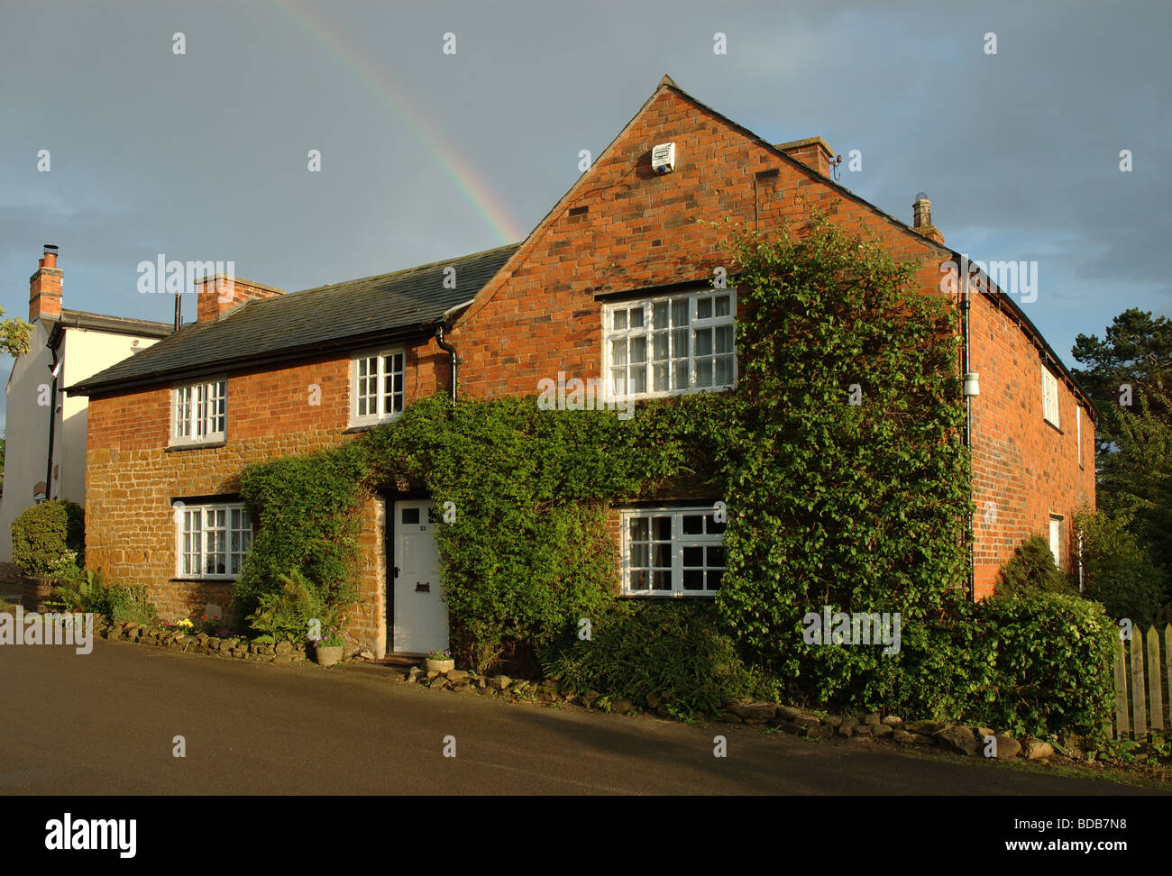 rainbow over country cottage, Hallaton, Leicestershire, England, UK Stock Photo
