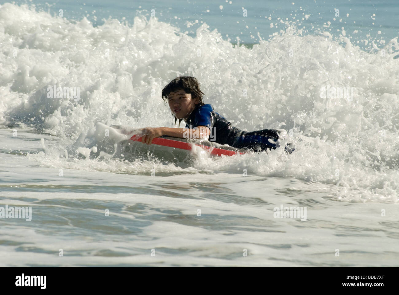 Boy bodysurfing on the Sunshine Coast , Queensland , Australia Stock Photo