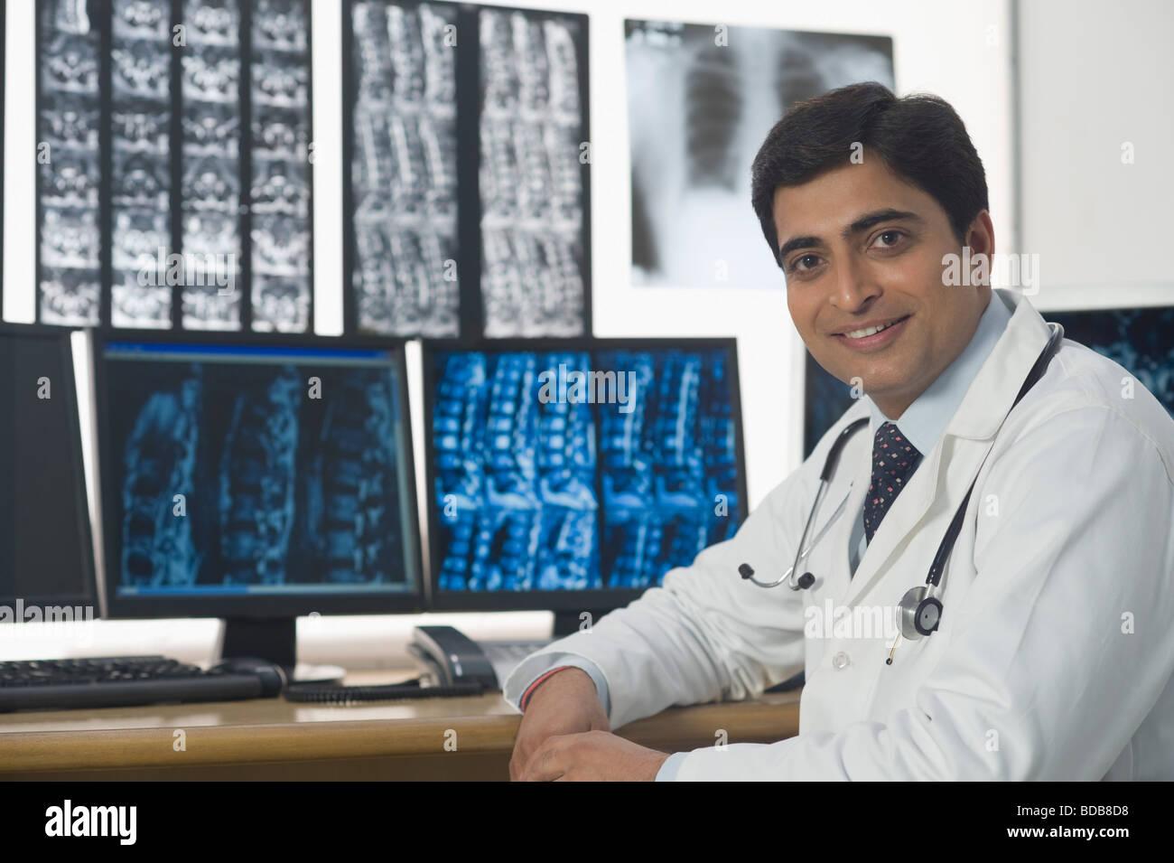 Portrait of a male doctor smiling Stock Photo - Alamy