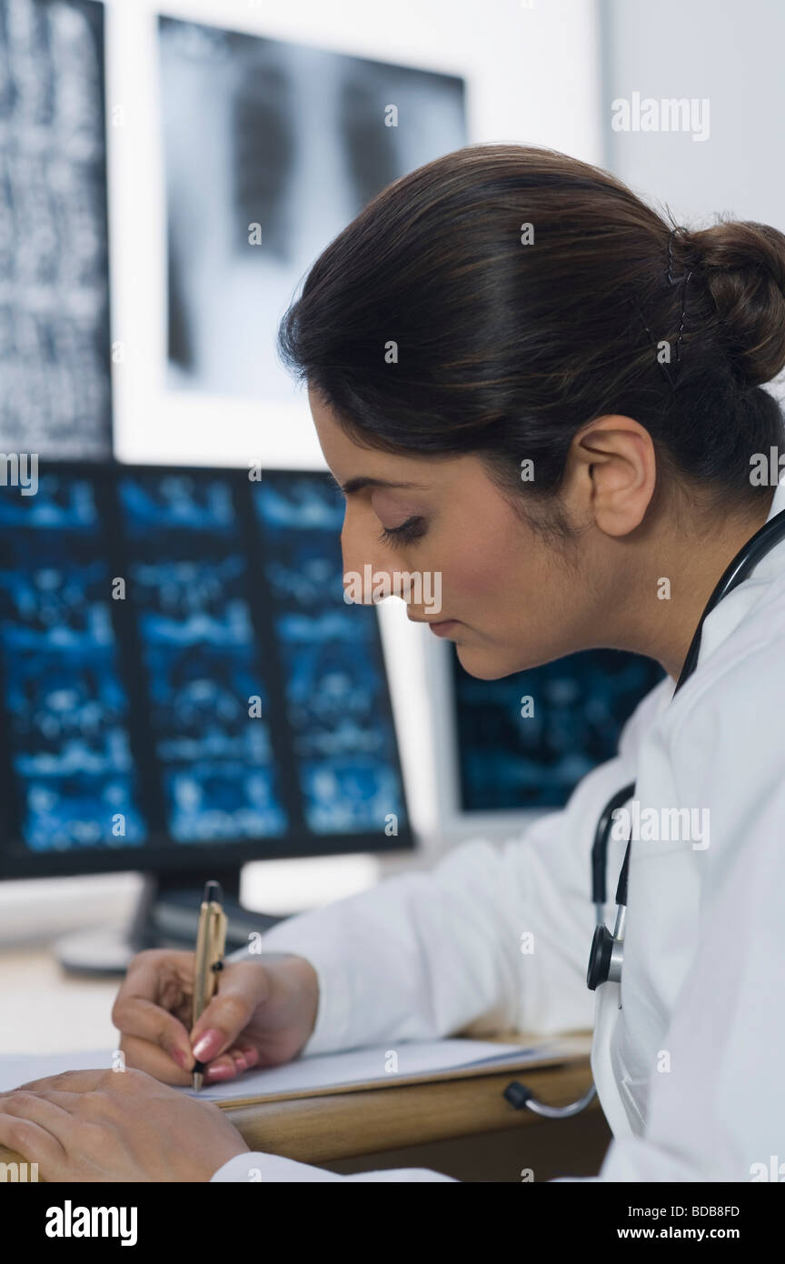 Female doctor writing a prescription Stock Photo - Alamy