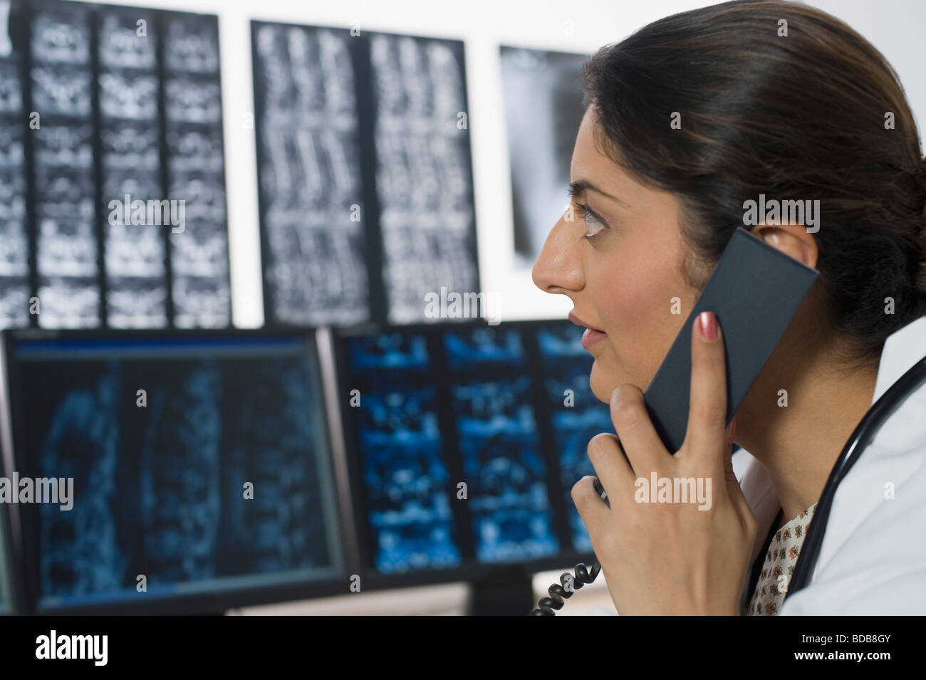 Female doctor talking on a phone Stock Photo