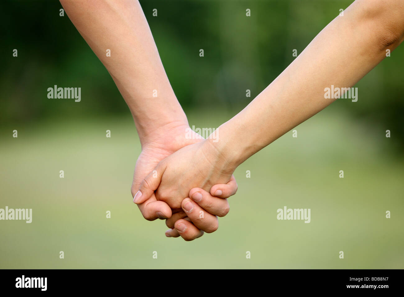 Hand in hand Stock Photo - Alamy