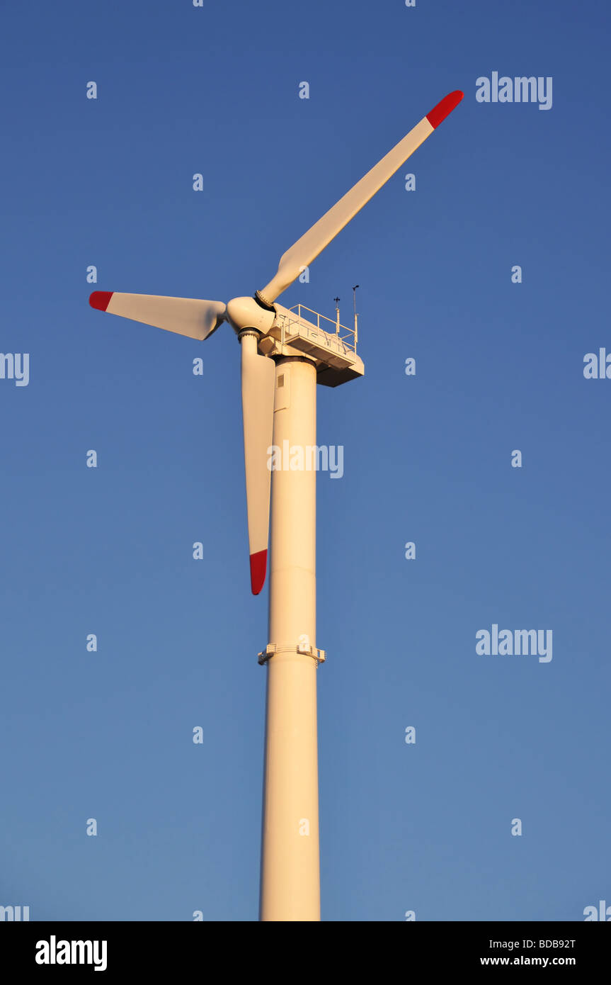 Wind turbine against a blue sky Stock Photo - Alamy
