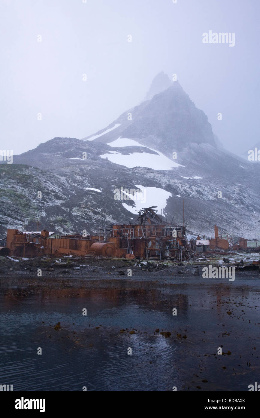 Prince Olav Harbour abandoned whaling station in snowstorm South Georgia Antarctica Stock Photo