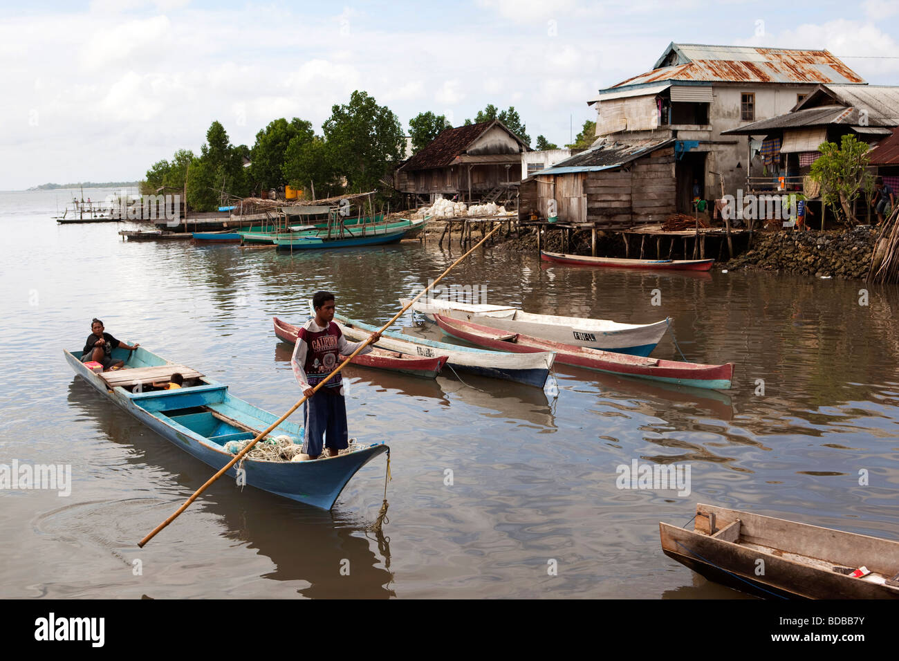Indonesia Sulawesi Kaledupa Island Ambuea village local fish market small fishing boat arriving with catch Stock Photo