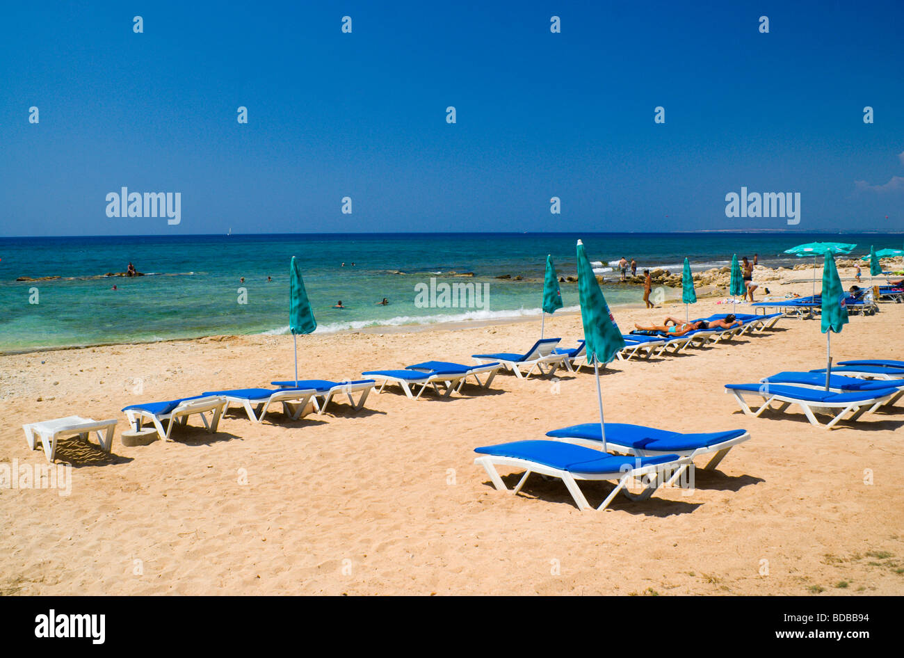 sun loungers and sunshades on beach ayia napa cyprus Stock Photo Alamy